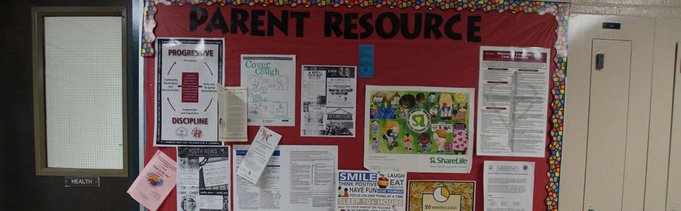 Parent resource bulletin board with various flyers.